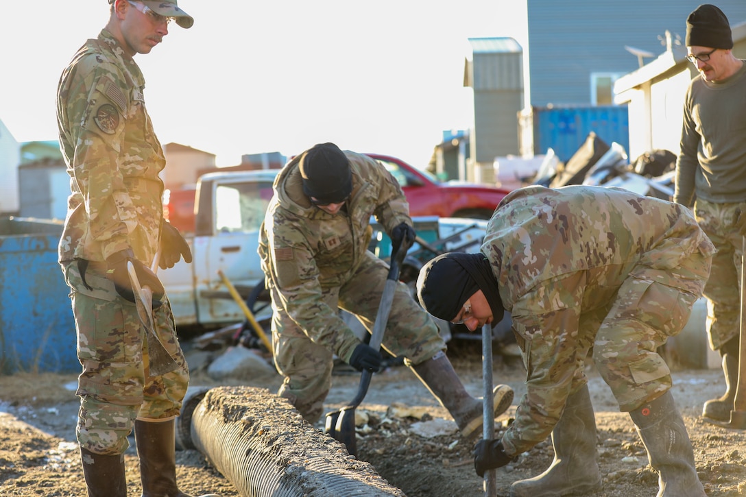 Alaska Organized Militia members assigned to Joint Task Force - Kotzebue assist the Arctic Circle community with recovery efforts, Oct. 26, 2024, following a recent storm that caused severe flooding along Alaska’s West Coast. The 11-member team, including personnel from the Alaska Air and Army National Guard and the Alaska State Defense Force, was activated by the State Emergency Operations Center to support response and recovery efforts.