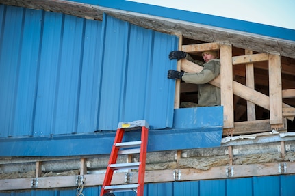 Alaska Organized Militia members assigned to Joint Task Force - Kotzebue assist the Arctic Circle community with recovery efforts, Oct. 26, 2024, following a recent storm that caused severe flooding along Alaska’s West Coast. The 11-member team, including personnel from the Alaska Air and Army National Guard and the Alaska State Defense Force, was activated by the State Emergency Operations Center to support response and recovery efforts.