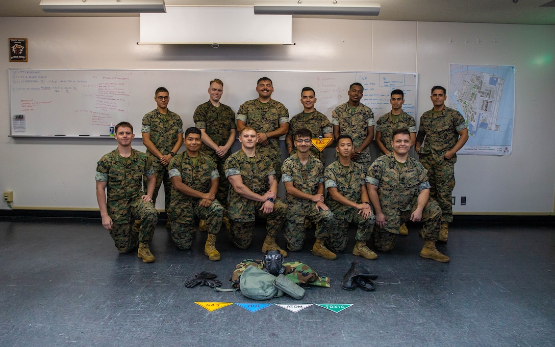 U.S. Marine Corps chemical, biological, radiological, and nuclear defense (CBRN) specialists assigned to Marine Wing Support Squadron 171, Marine Aircraft Group 12, pose for a group photo on Marine Corps Air Station Iwakuni, Japan, Sept. 6, 2024. As CBRN Defense Specialists, Marines are trained to respond to and clear areas with possible CBRN hazards in addition to training units in general CBRN information, identification, and response. (U.S. Marine Corps photo by Sgt. Phuchung Nguyen)