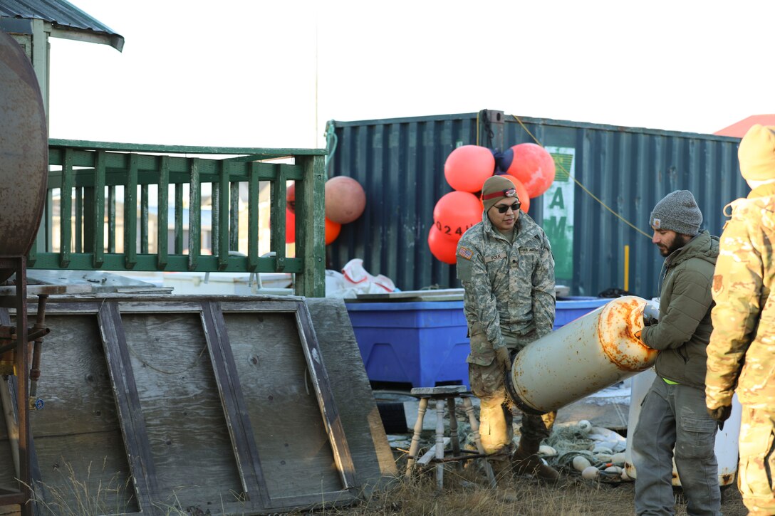 Alaska Organized Militia members assigned to Joint Task Force - Kotzebue assist the Arctic Circle community with recovery efforts, Oct. 26, 2024, following a recent storm that caused severe flooding along Alaska’s West Coast. The 11-member team, including personnel from the Alaska Air and Army National Guard and the Alaska State Defense Force, was activated by the State Emergency Operations Center to support response and recovery efforts.