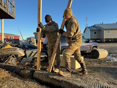 Alaska Organized Militia members assigned to Joint Task Force - Kotzebue assist the Arctic Circle community with recovery efforts, Oct. 26, 2024, following a recent storm that caused severe flooding along Alaska’s West Coast. The 11-member team, including personnel from the Alaska Air and Army National Guard and the Alaska State Defense Force, was activated by the State Emergency Operations Center to support response and recovery efforts.