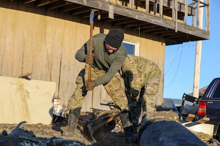 Alaska Organized Militia members assigned to Joint Task Force - Kotzebue assist the Arctic Circle community with recovery efforts, Oct. 26, 2024, following a recent storm that caused severe flooding along Alaska’s West Coast. The 11-member team, including personnel from the Alaska Air and Army National Guard and the Alaska State Defense Force, was activated by the State Emergency Operations Center to support response and recovery efforts.