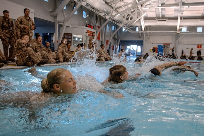 U.S. Marine Corps recruits with Fox Company, 2nd Recruit Training Battalion, participate in a swim qualification event at Marine Corps Recruit Depot San Diego, California, Oct. 21, 2024. The basic swim qualification consists of a 25-meter swim, tower jump into the water, four-minute tread, 25-meter pack swim, and an underwater gear shed. (U.S. Marine Corps photo by Cpl. Sarah M. Grawcock)