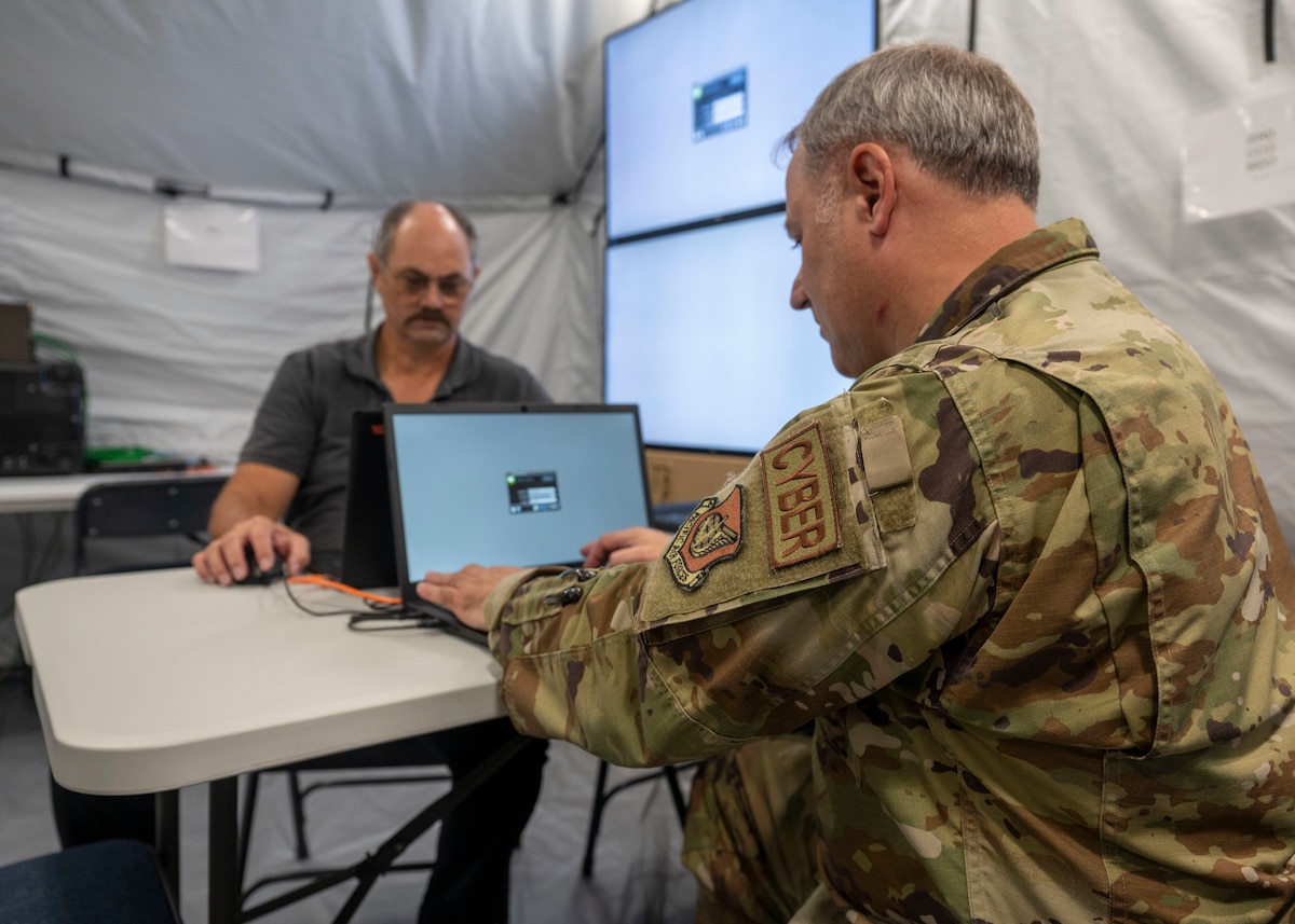 Photo of Air Force personnel logging into computers