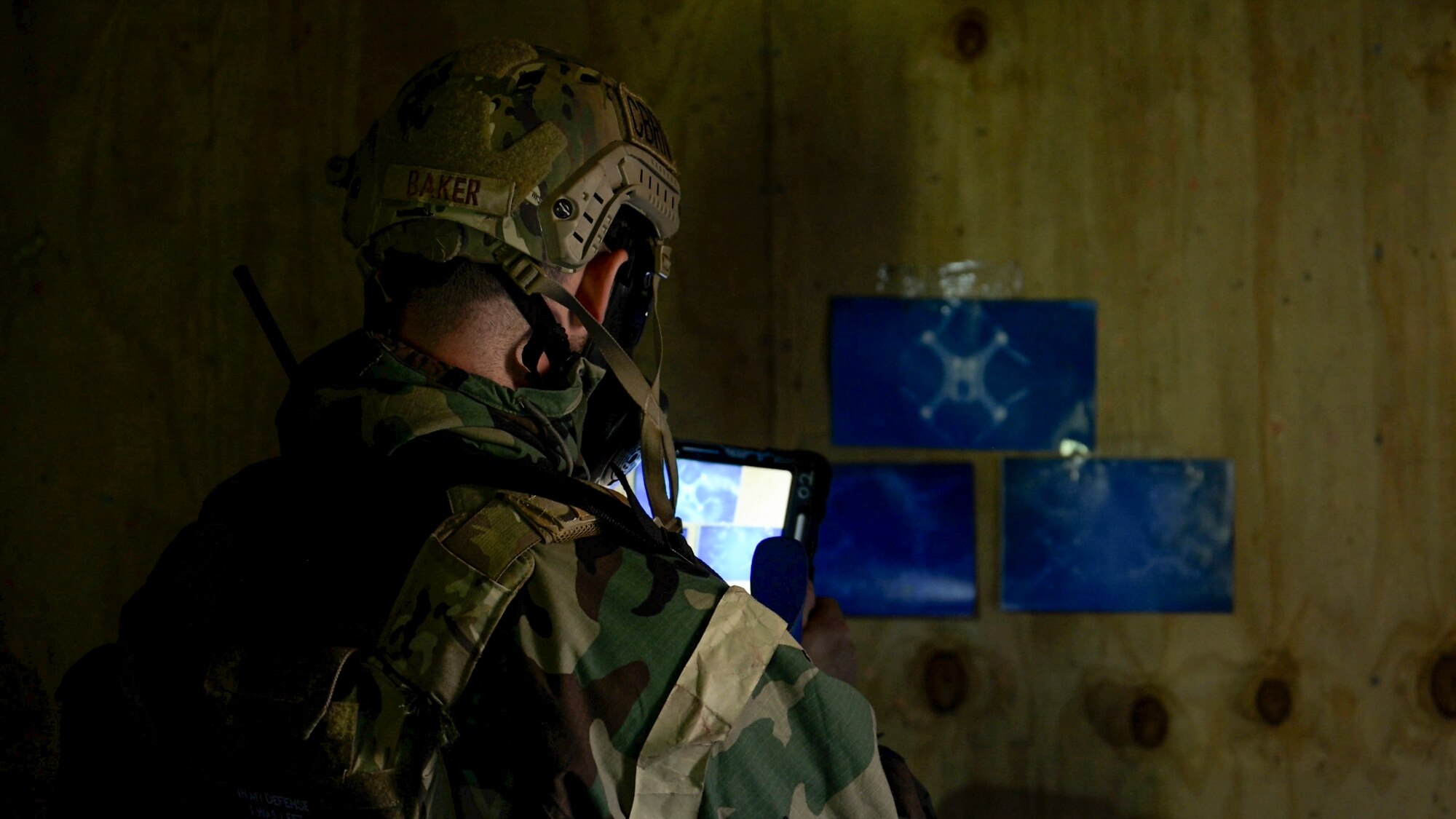 U.S. Air Force Senior Airman Samuel Baker, operations team member assigned to the 316th Civil Engineer Squadron, collects evidence during a Chemical, Biological, Radiological, and Nuclear training exercise at Joint Base Andrews, Md., Aug. 23, 2024. Baker documented findings as part of the evidence-gathering process, a critical step in identifying and neutralizing potential threats in simulated hazardous environments. (U.S. Air Force photo by Staff Sgt. Isaac March)