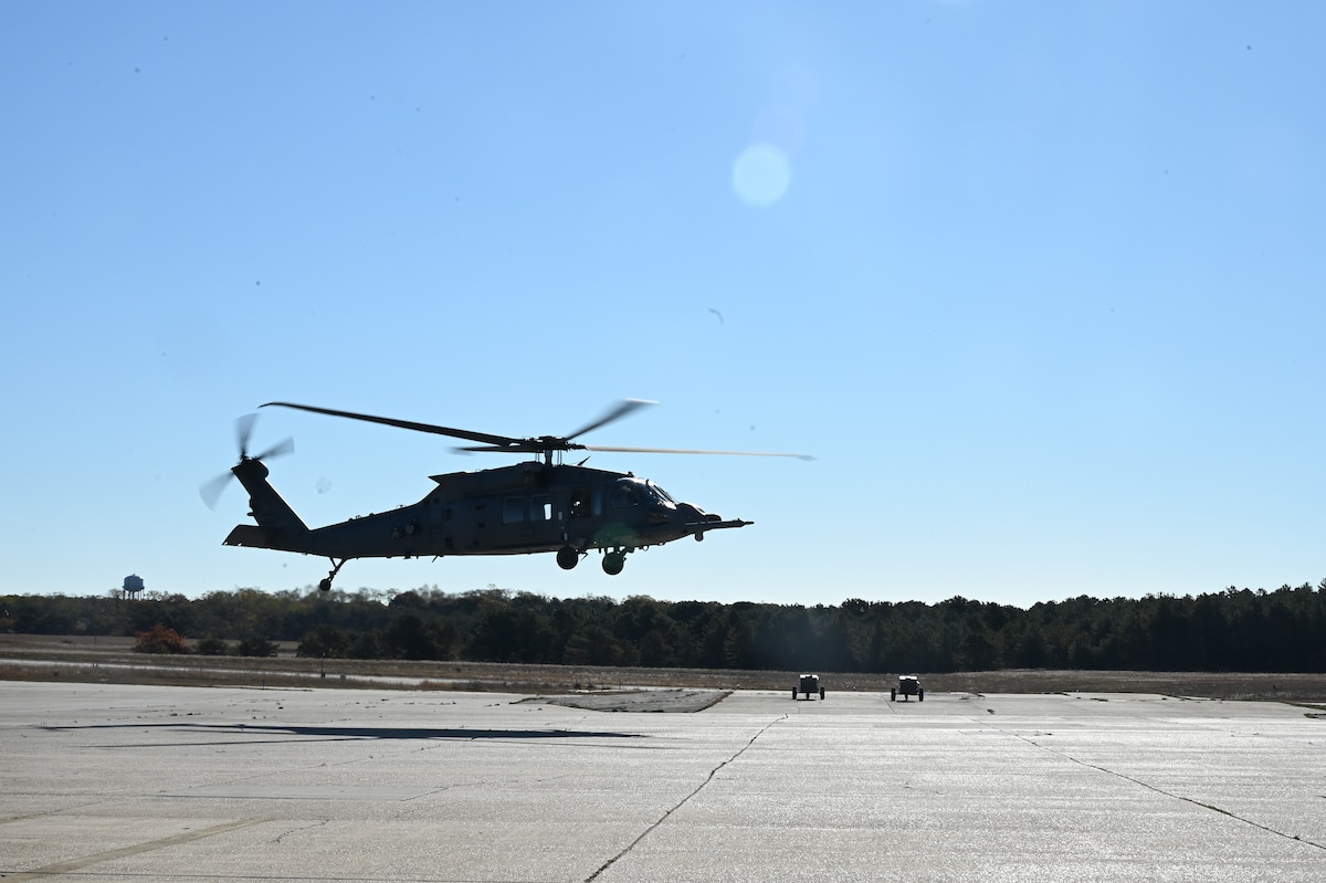 An HH-60W Jolly Green II search and rescue helicopter assigned to the 106th Rescue Wing conducts a flyover during an HH-60W conversion ceremony at the 106th Rescue Wing at Francis S. Gabreski Air National Guard Base, Westhampton Beach, N.Y., Oct. 25, 2024. The ceremony celebrated the official conversion of the 106th from the HH-60G Pave Hawk search and rescue helicopter to the HH-60W Jolly Green II.