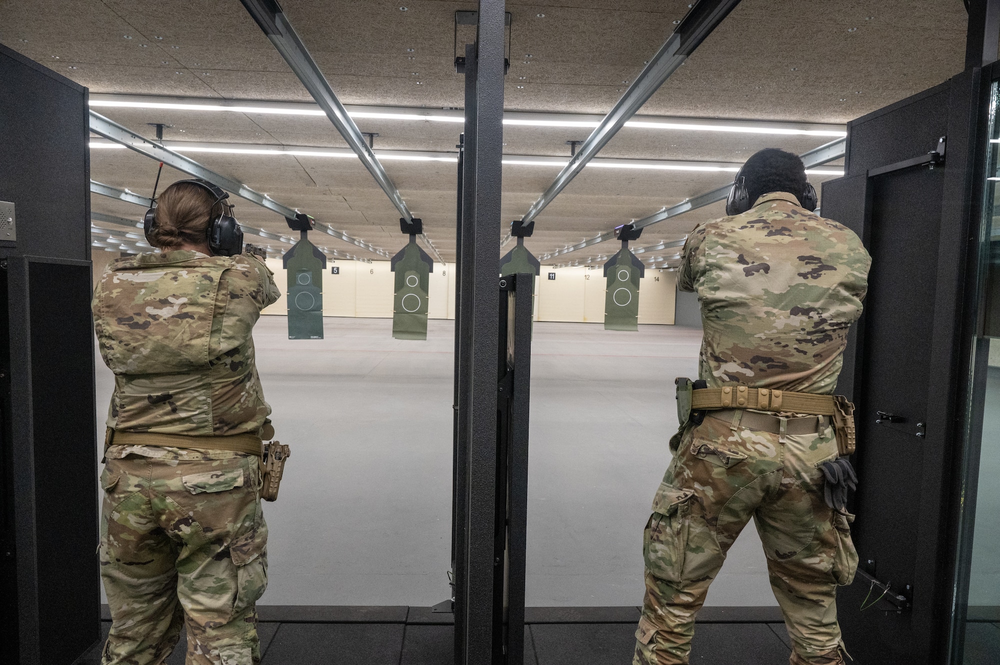 Airmen fire M18 handguns as part of small arms qualification at the new indoor range at Goldwater Air National Guard Base, Phoenix, Oct. 5, 2024. Staying proficient in individual weapon systems keeps Airmen deployable and mission-ready.