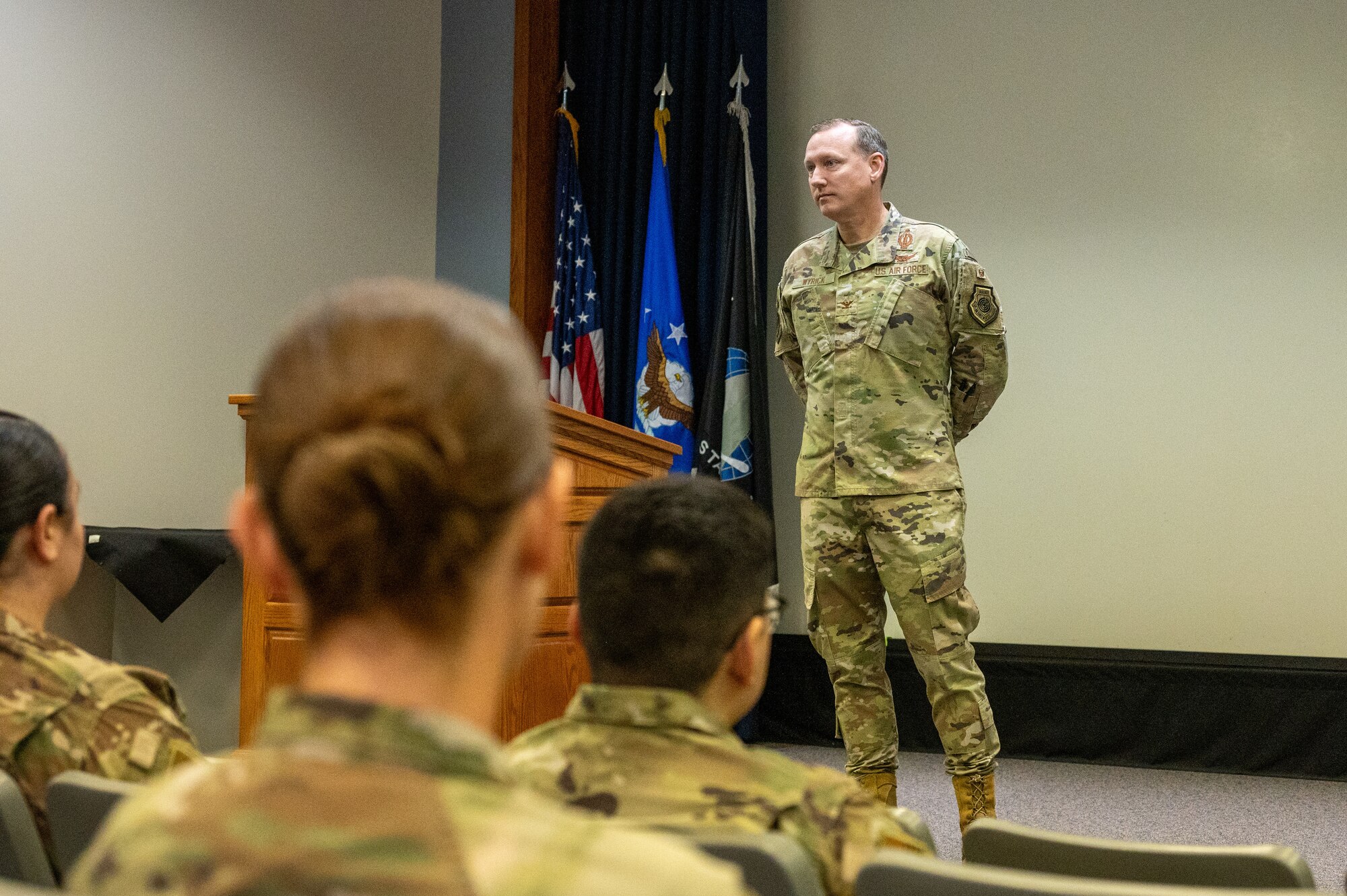 Col. David Wyrick, 377th Air Base Wing deputy commander listens to a question at the First Sergeants Symposium on Kirtland Air Force Base, N.M. on Oct. 28. Wyrick spoke on the importance of the First Sergeant role and the role they play in protecting the well-being of airmen. (U.S. Air Force photo by Airman 1st Class Donnell Schroeter)