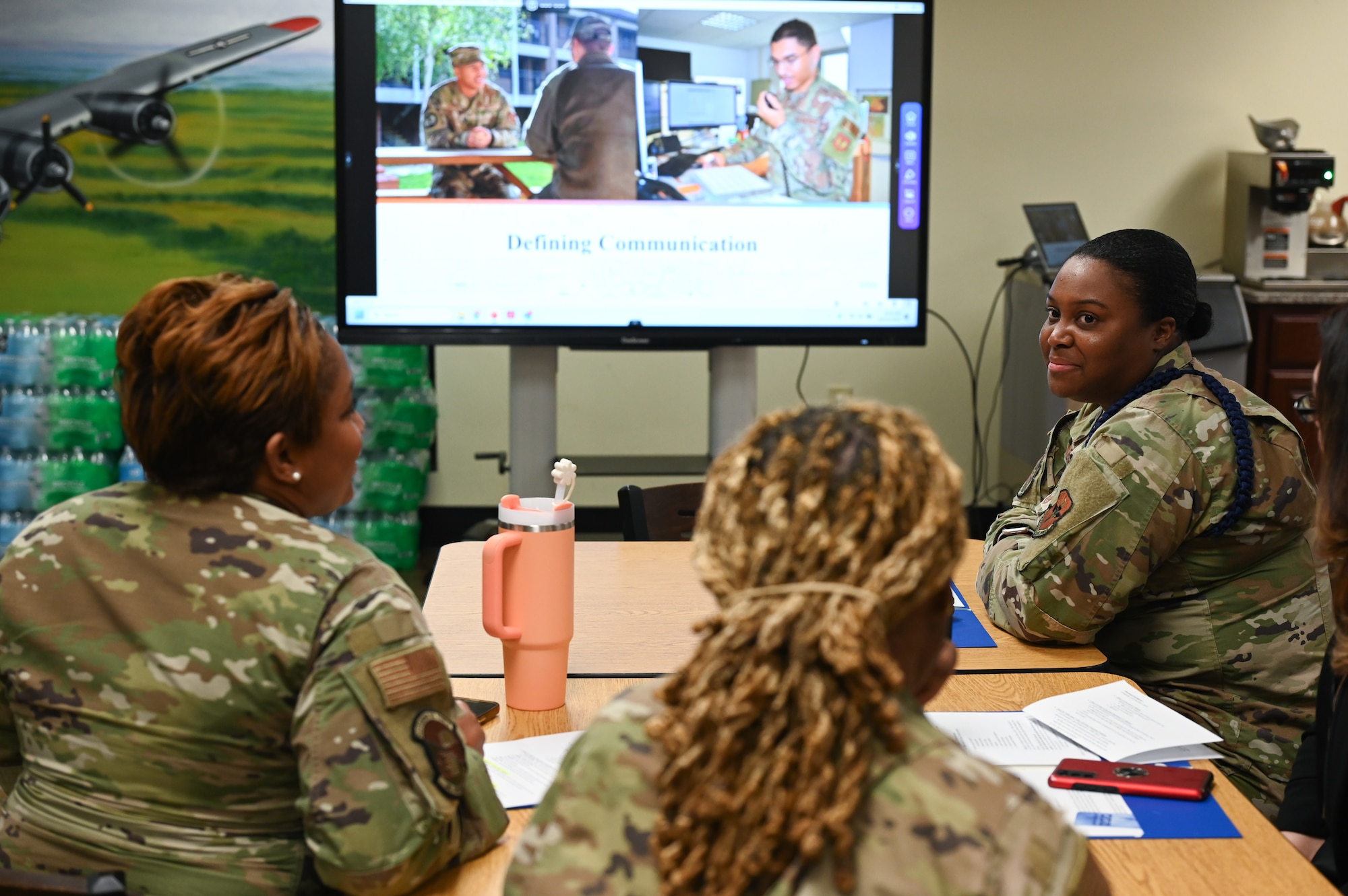 U.S. Air Force Tech. Sgt. Janel Barnes, 37th Training Wing military training leader, interacts with her team