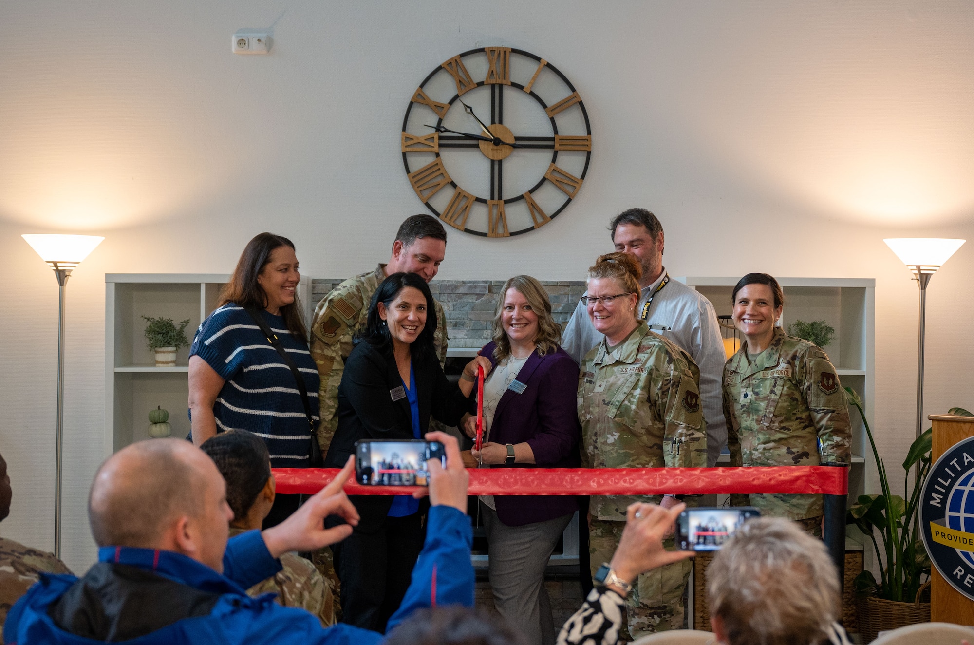 People cut a ribbon