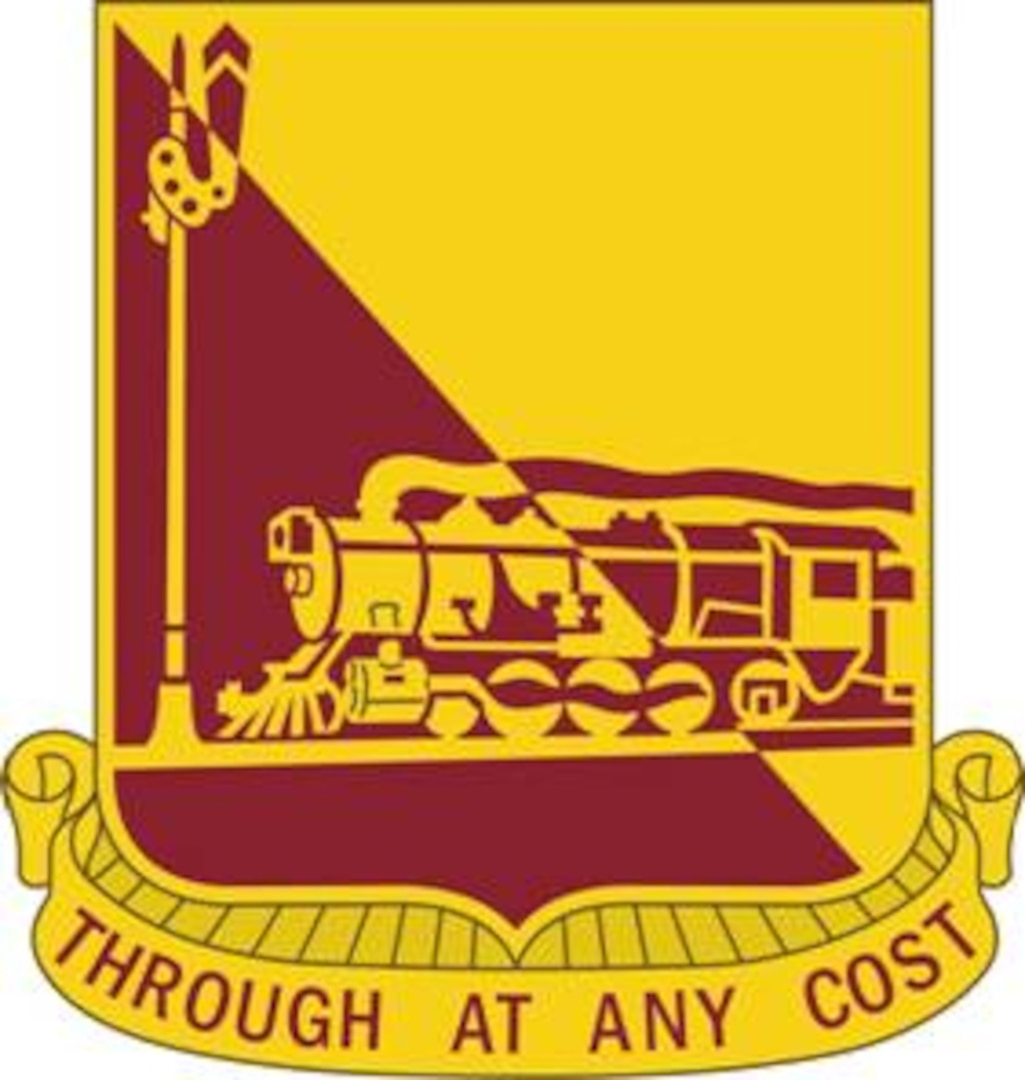 a red and yellow shield with an old style steam engine moving from right to left with smoke coming out of the stack. at the bottom are the words "Through at any cost"