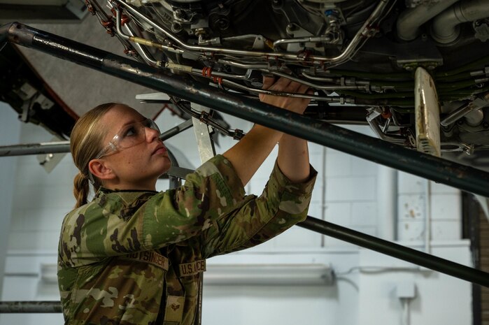 An Airmen works on a simulated C-17 Globemaster III engine