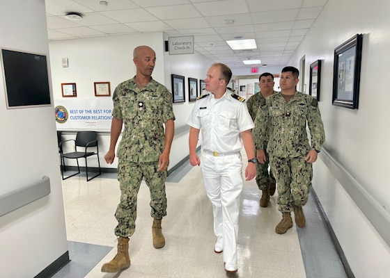 GUANTANAMO BAY, Cuba - Lt. Cmdr. Jermaine Johnson, director for administration at U.S. Naval Hospital Guantanamo Bay, talks with talks with Royal Netherlands Navy Lt. Jan-Peter Schaap during a tour of the hospital emergency department, Oct. 9, 2024. Schaap is a medical doctor aboard the HNMLS Holland (P840) and visited the hospital at U.S. Naval Station Guantanamo Bay during a scheduled visit to learn about hospital capabilities and the medical services provided. (U.S. Navy photo by Emily McCamy/released)