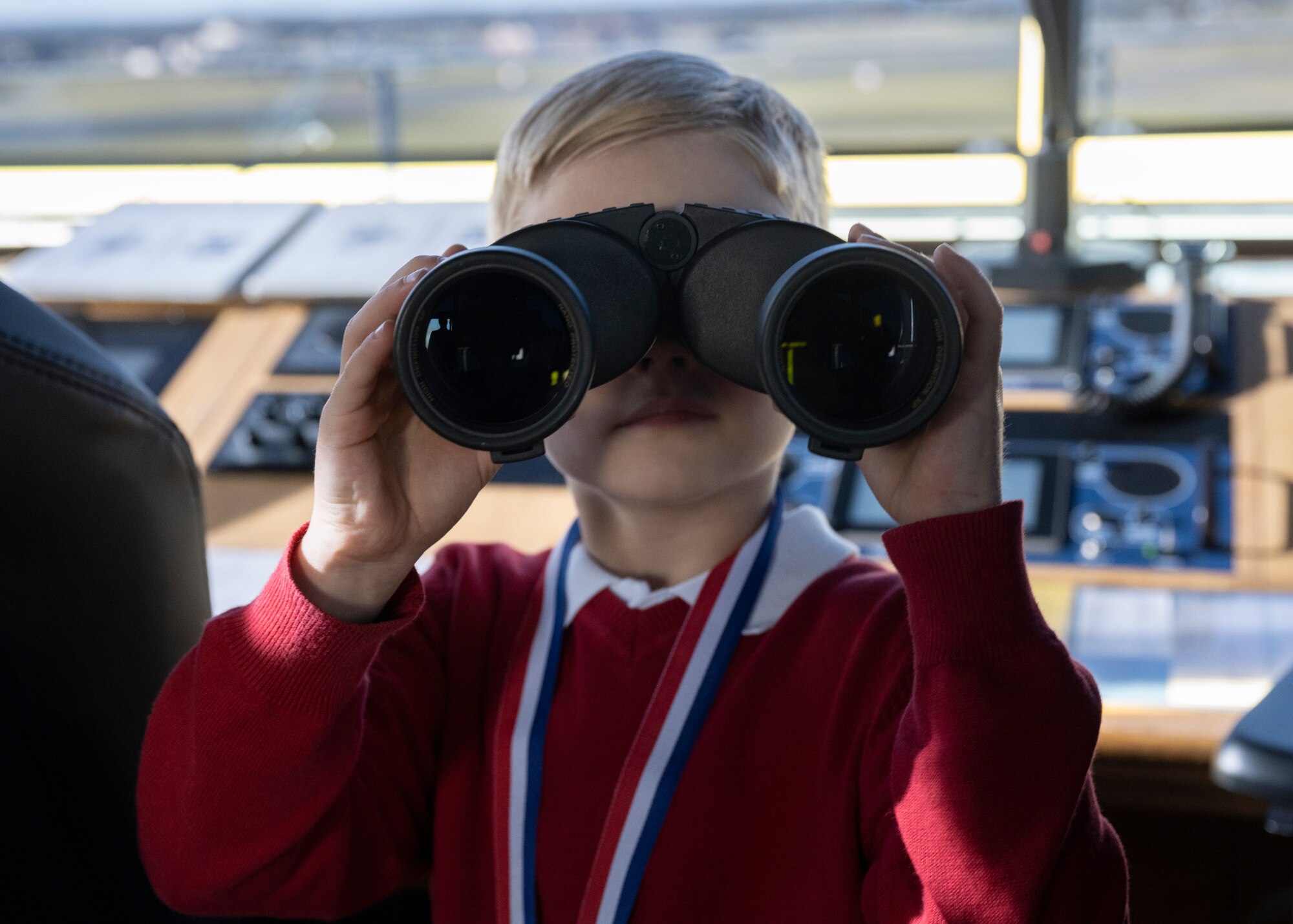 A competition winner for Royal Air Force Mildenhall’s 90th birthday coloring/writing competition poses for a picture at RAF Mildenhall, England, Oct. 17, 2024.
