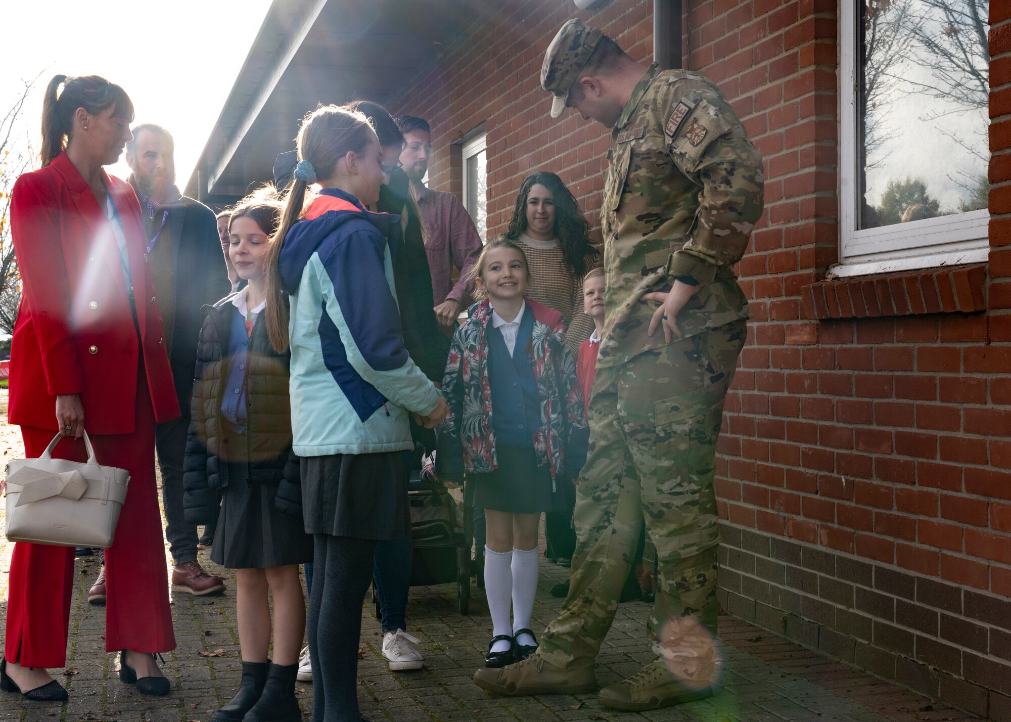 U.S. Air Force Staff Sgt. Zachary Barna, 100th Civil Engineer Squadron fire protection crew chief, speaks to competition winners and their guardians at Royal Air Force Mildenhall, England, Oct. 17, 2024.