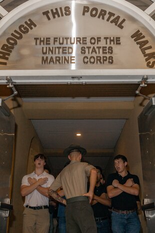 U.S. Marine Corps Sgt. Harrison Springer, a drill instructor with Receiving Company, Support Training Battalion, briefs recruits with Lima Company, 3rd Recruit Training Battalion, during a receiving event at Marine Corps Recruit Depot San Diego, Oct. 21, 2024. During the receiving process, recruits are checked for contraband, given haircuts, make scripted phone calls home, and are issued gear required for training. (U.S. Marine Corps photo by Lance Cpl. Janell B. Alvarez)