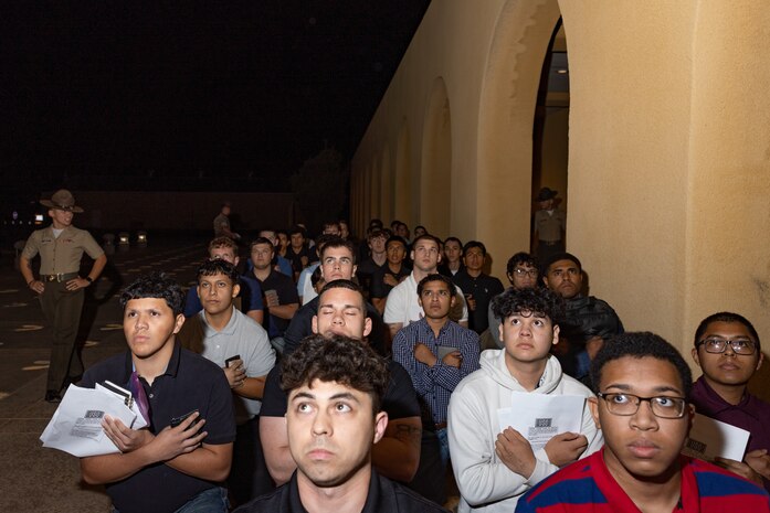 U.S. Marine Corps recruits with Lima Company, 3rd Recruit Training Battalion, are briefed as part of a receiving event at Marine Corps Recruit Depot San Diego, California, Oct. 21, 2024. During the receiving process, recruits are checked for contraband, given haircuts, make scripted phone calls home, and are issued gear required for training. (U.S. Marine Corps photo by Lance Cpl. Janell B. Alvarez)