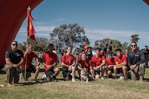 U.S. Marine Corps Lance Cpl. Bruno, the Marine Corps Recruit Depot San Diego and Western Recruiting Region mascot, poses for a photo with Marines and prospective applicants from the San Diego area before the 2024 Marine Corps Recruit Depot San Diego Boot Camp Challenge at MCRD San Diego, California, Oct. 19, 2024. For the past 23 years, MCRD San Diego has hosted the Boot Camp Challenge, a three-mile obstacle course race guided by 60 drill instructors that highlights the physical and mental demands of bootcamp. The event fosters comradery and community engagement through interaction with MCRD personnel. (U.S. Marine Corps photo by Cpl. Sarah M. Grawcock)
