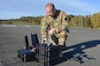 U.S. Army Chief Warrant Officer 2 Nathan Shea assigned to Headquarters and Headquarters Company, 56th Stryker Brigade Combat Team, 28th Infantry Division, Pennsylvania National Guard maneuvers a drone during a test flight at Grafenwoehr Training Area, Germany, Oct. 11, 2024. Unmanned aircraft systems operators are required to have four hours of flight time each month to ensure their skills remain sharp and ready to meet the Army’s needs. (U.S. Army National Guard photo by Pfc. Israel Fernandez)