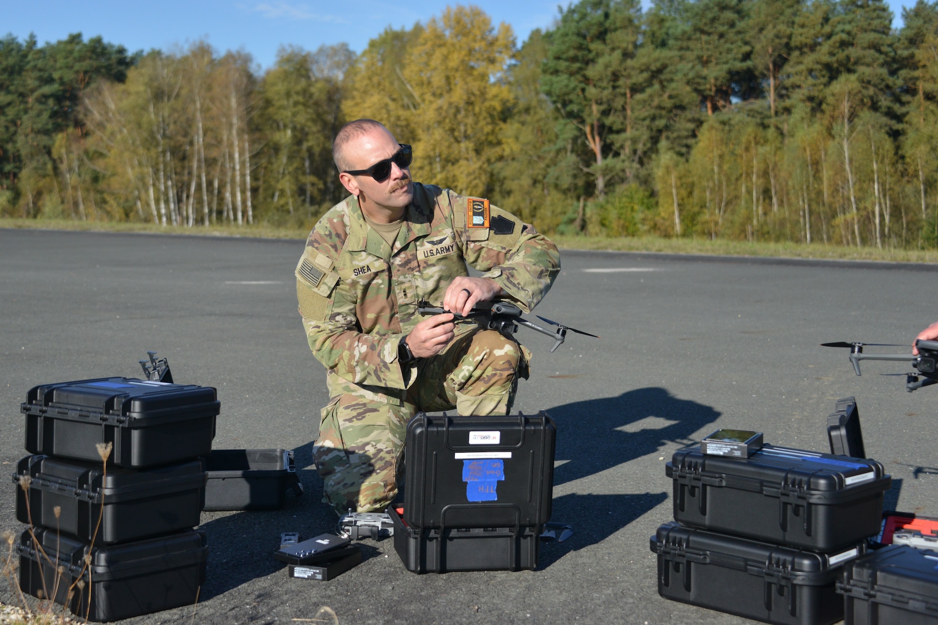 U.S. Army Chief Warrant Officer 2 Nathan Shea assigned to Headquarters and Headquarters Company, 56th Stryker Brigade Combat Team, 28th Infantry Division, Pennsylvania National Guard maneuvers a drone during a test flight at Grafenwoehr Training Area, Germany, Oct. 11, 2024. Unmanned aircraft systems operators are required to have four hours of flight time each month to ensure their skills remain sharp and ready to meet the Army’s needs. (U.S. Army National Guard photo by Pfc. Israel Fernandez)