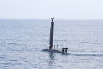 The TRITON unmanned drone operates along the surface on the Florida Gulf Coast Test Ranges, Aug. 15. This exercise successfully integrated multiple unmanned systems from contracting partners to collect and transmit real-time environmental data to a forward-deployed shore station. The experiment also tested novel data exfiltration methods, demonstrated regional partnering, and leveraged prior Navy and non-Navy development efforts to advance subsea warfare (SSW) mission capabilities. (U.S. Navy photo by Eddie Green)
