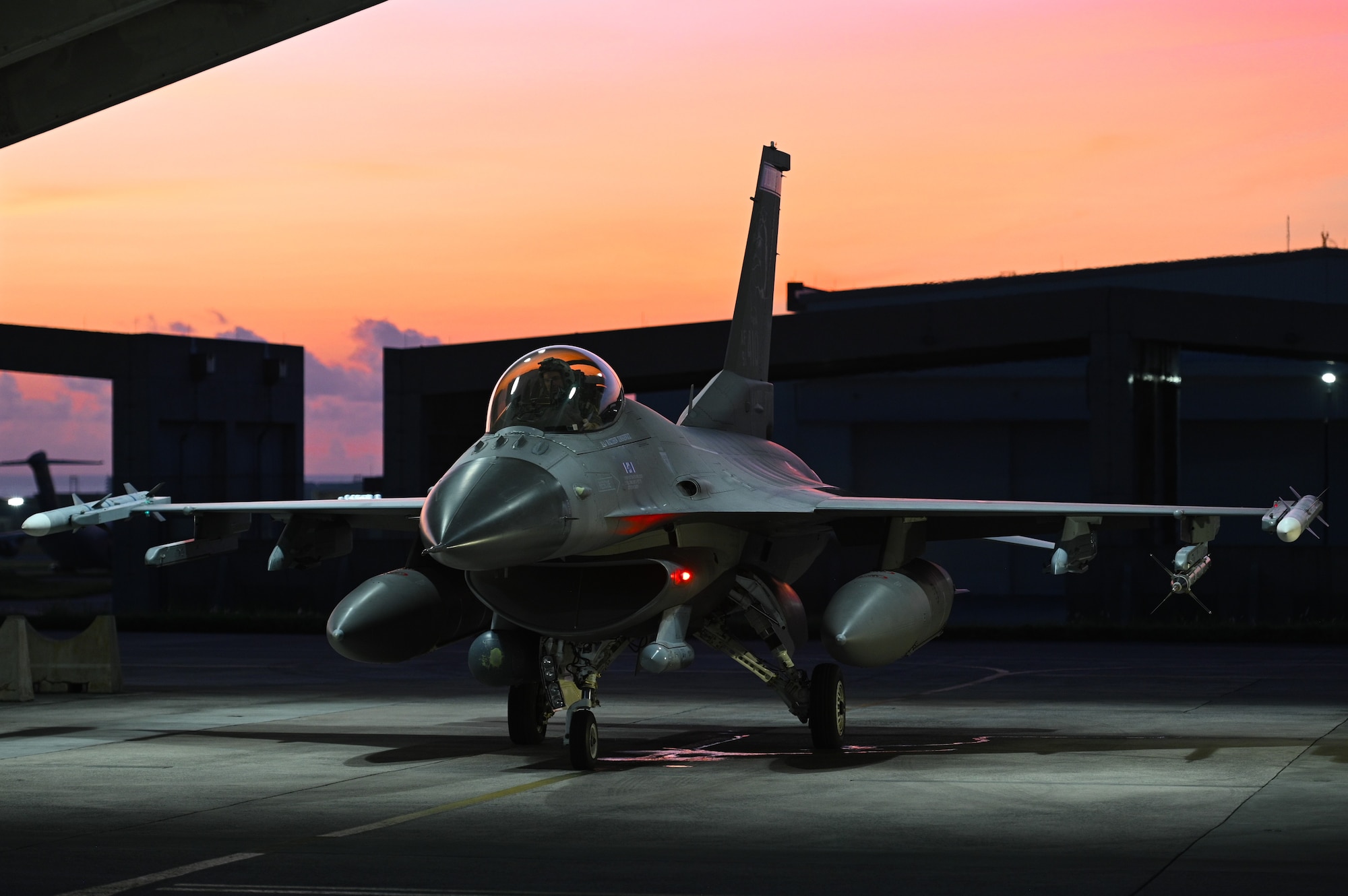 A pilot and F-16 Fighting Falcon assigned to the 179th Fighter Squadron, 148th Fighter Wing, Minnesota Air National Guard, prepare for flight while deployed to Kadena Air Force Base, Japan, on August 22, 2024. The 148th is at Kadena as part of a rotational deployment demonstrating the U.S. commitment to the Indo-Pacific region. (U.S. Air National Guard photo by Airman 1st Class Addie Peterson)