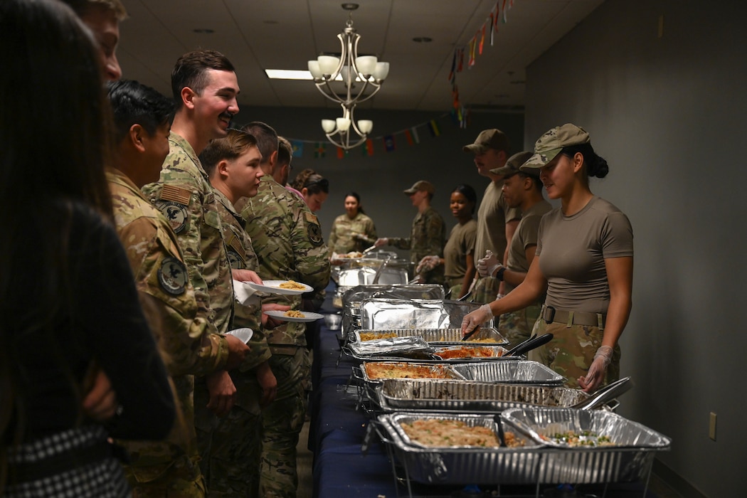 People stand in line for food.