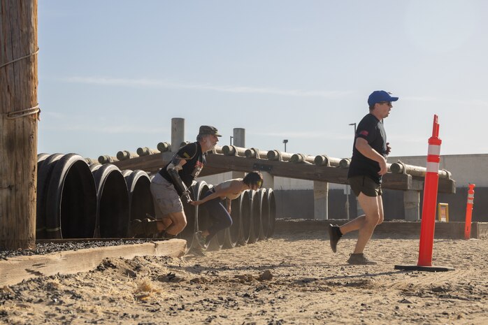 Contestants participate in the 2024 Marine Corps Recruit Depot San Diego Boot Camp Challenge at MCRD San Diego, California, Oct. 19, 2024. For the past 23 years, MCRD San Diego has hosted the bootcamp Challenge, a three-mile obstacle course race guided by 60 drill instructors that highlights the physical and mental demands of bootcamp. The event fosters camaraderie and community engagement through interaction with MCRD personnel. (U.S. Marine Corps photo by Lance Cpl. Janell B. Alvarez)