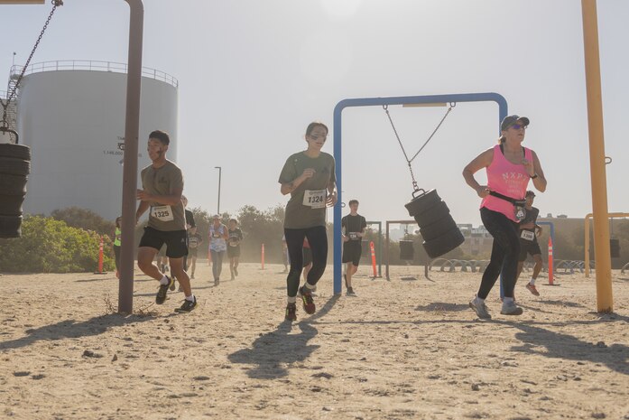 Contestants participate in the 2024 Marine Corps Recruit Depot San Diego Boot Camp Challenge at MCRD San Diego, California, Oct. 19, 2024. For the past 23 years, MCRD San Diego has hosted the bootcamp Challenge, a three-mile obstacle course race guided by 60 drill instructors that highlights the physical and mental demands of bootcamp. The event fosters camaraderie and community engagement through interaction with MCRD personnel. (U.S. Marine Corps photo by Lance Cpl. Janell B. Alvarez)