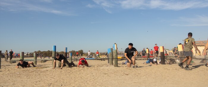 Contestants of the 2024 Marine Corps Recruit Depot San Diego Boot Camp Challenge challenge participate in the obstacles of the race at MCRD San Diego, California, Oct. 19, 2024. For the past 23 years, MCRD San Diego has hosted the bootcamp Challenge, a three-mile obstacle course race guided by 60 drill instructors that highlights the physical and mental demands of bootcamp. The event fosters camaraderie and community engagement through interaction with MCRD personnel. (U.S. Marine Corps photo by Lance Cpl. Janell B. Alvarez)