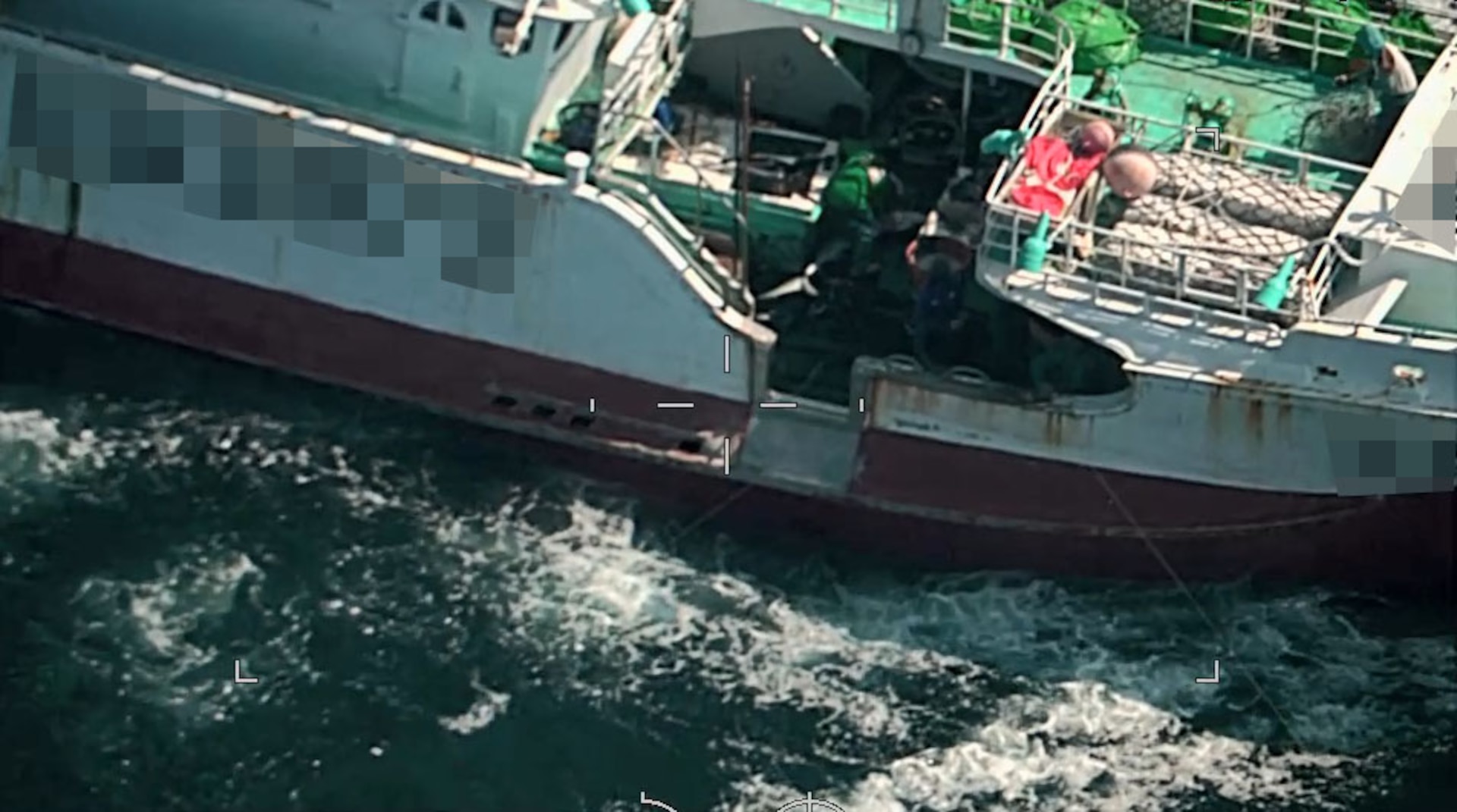 A foreign fishing vessel crew conducting shark finning operations on deck in the North Pacific, May 12, 2024. Regional Fisheries Management Organizations regulate the process of shark finning through Conservation and Management Measures. These measures require fully utilizing retained catches of sharks and limits on amounts of fins onboard in relation to those sharks. (U.S. Coast Guard courtesy photo)