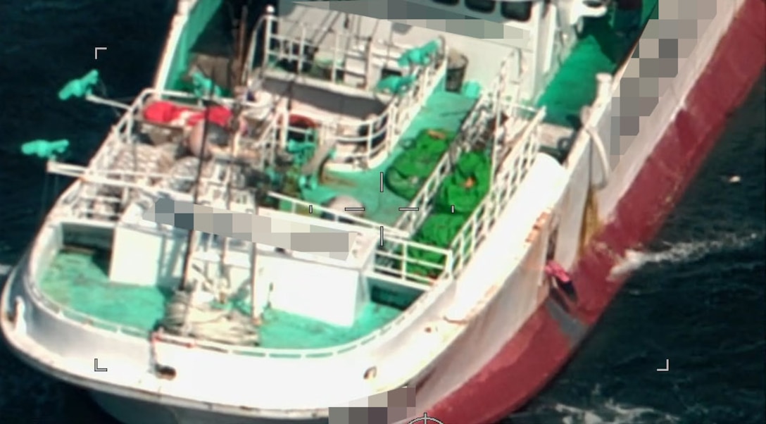 A foreign fishing vessel discarding a shark head carcass while conducting shark finning operations in the North Pacific, May 12, 2024. Regional Fisheries Management Organizations regulate the process of shark finning through Conservation and Management Measures. These measures require fully utilizing retained catches of sharks and limits on amounts of fins onboard in relation to those sharks. (U.S. Coast Guard courtesy photo)