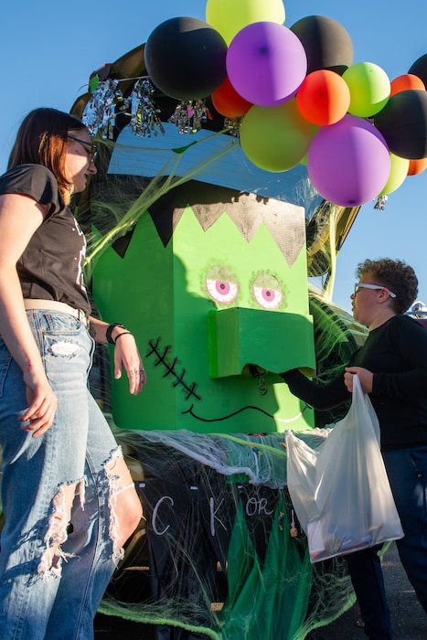 Kid reaching into decoration for candy