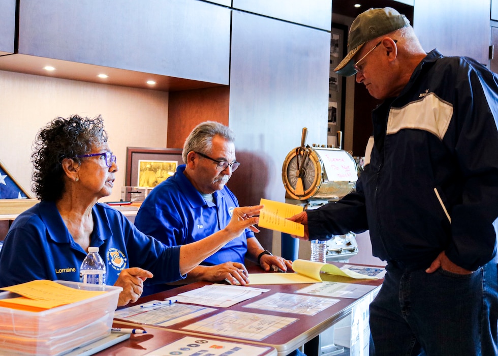 Lorraine Ahumada, Retiree Activities Office volunteer, and Tim Ahumada, RAO volunteer, provide program information during the Retiree Appreciation Day event, Oct. 19, 2024, at Luke Air Force Base, Arizona.