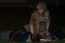 Airman provides care to simulated casualty