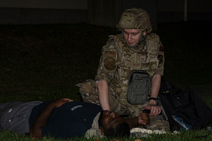 Airman provides care to simulated casualty