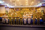 U.S. and Royal Malaysian Armed Forces pose for a group photo during the opening ceremony of Cooperation Afloat Readiness and Training (CARAT) Malaysia 2024, October 29.