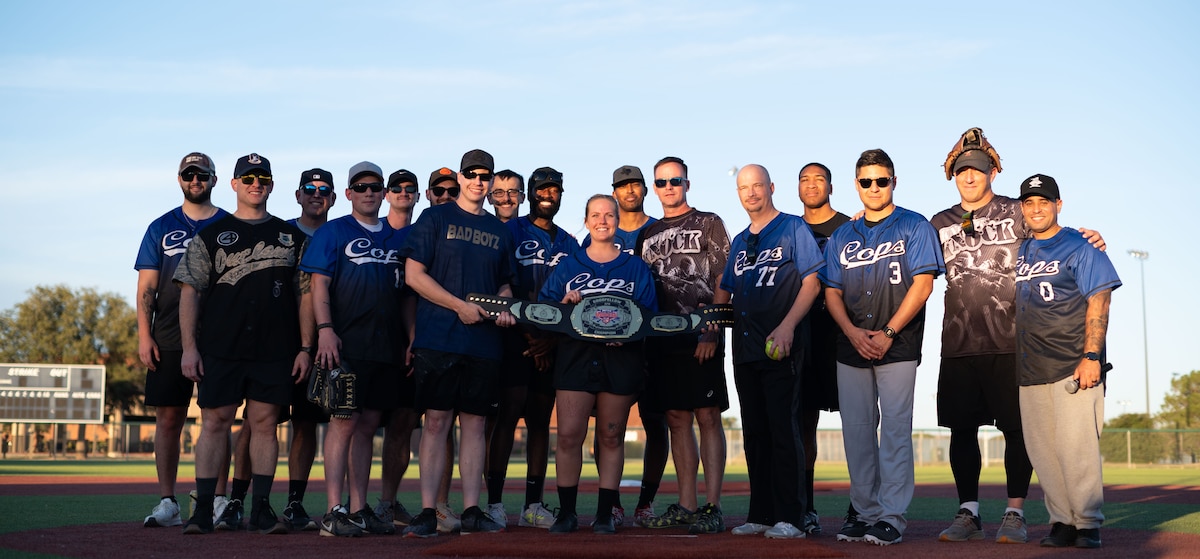 The U.S. Air Force 17th Security Forces Squadron poses for a group photo after winning the Inaugural Battle of the Badges softball game at the Mathis Fitness Center at Goodfellow Air Force Base Texas, Oct. 28, 2024. The 17th SFS won the softball game with a score of 16-8. (U.S. Air Force photo by Airman 1st Class Brian Lummus)