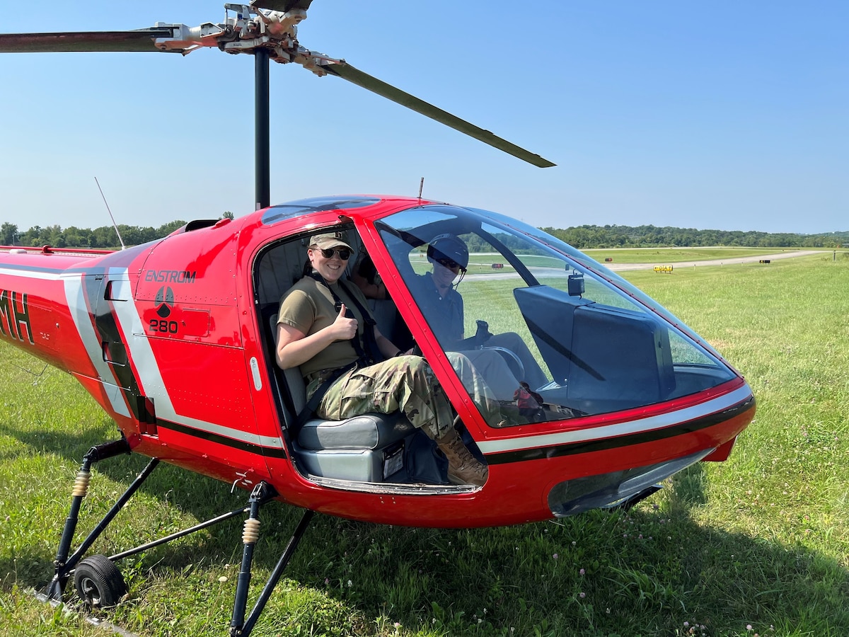 Capt. Andrea Bartlett prepares to receive an orientation flight in a helicopter as part of a flight surgeon training course.