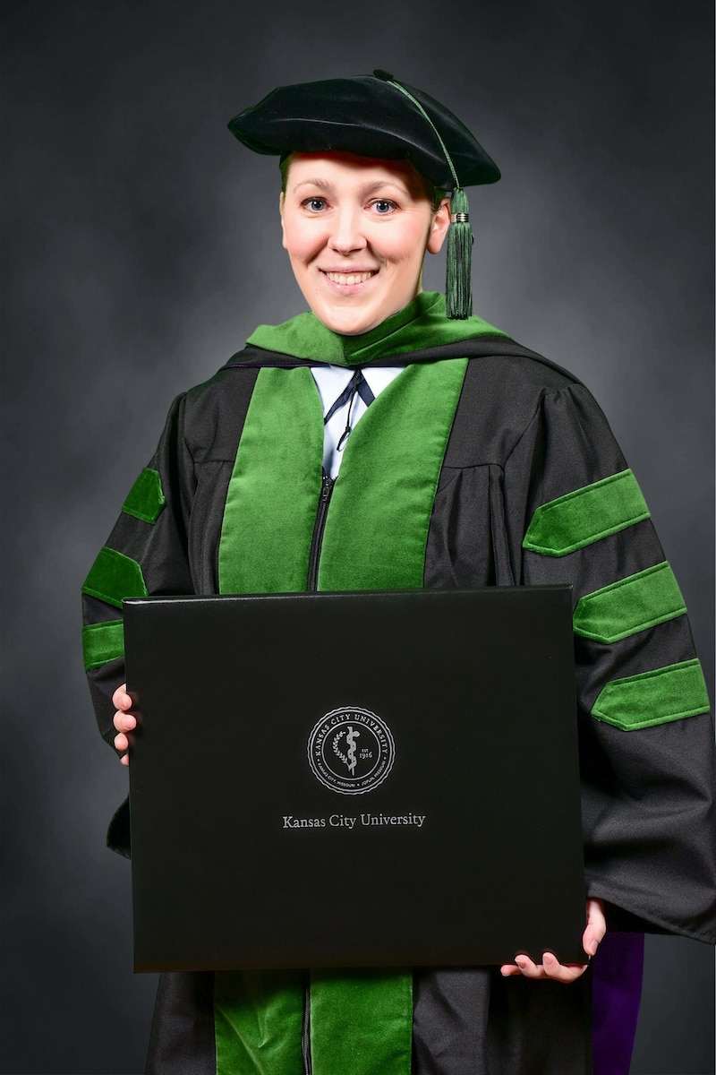 Andrea Bartlett poses for her medical school graduation photo from Kansas City University on May 7, 2022. Capt. Bartlett is now a flight surgeon at Maxwell Air Force Base, Ala.