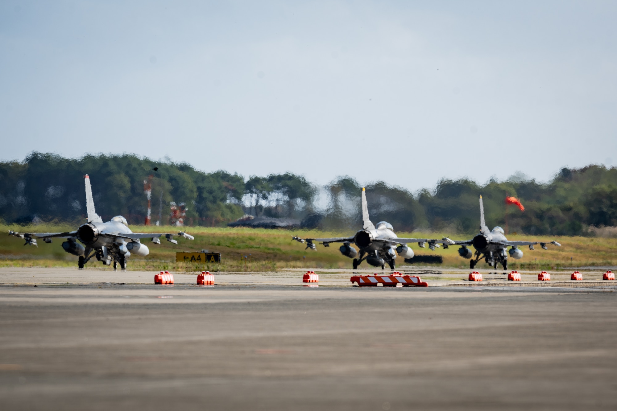 F-16 Fighting Falcons taxi on the flightline
