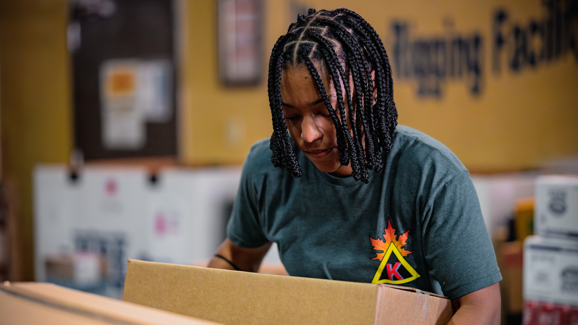 Soldier helps move boxes