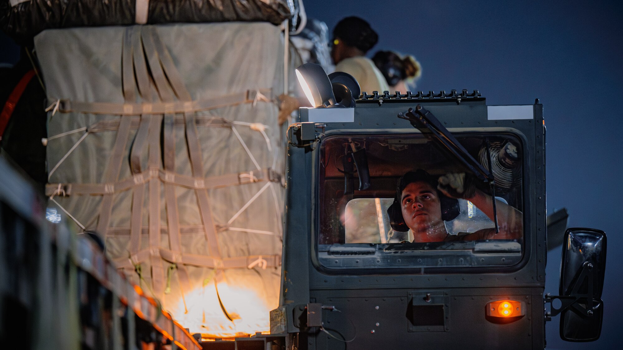 Airman operates cargo loader