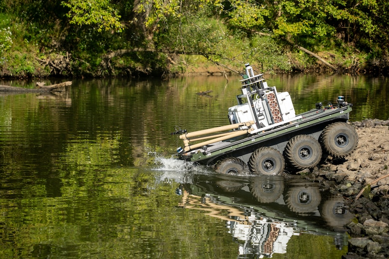 DamBot 1.0 makes a splash as it enters the water during a dam conduit inspection at Taylorsville Lake in Taylorsville, Ky., Sept. 19, 2024. DamBot 1.0 is just over 5-ft wide, 10-ft long and about 6.5-ft tall with all components installed and stowed.