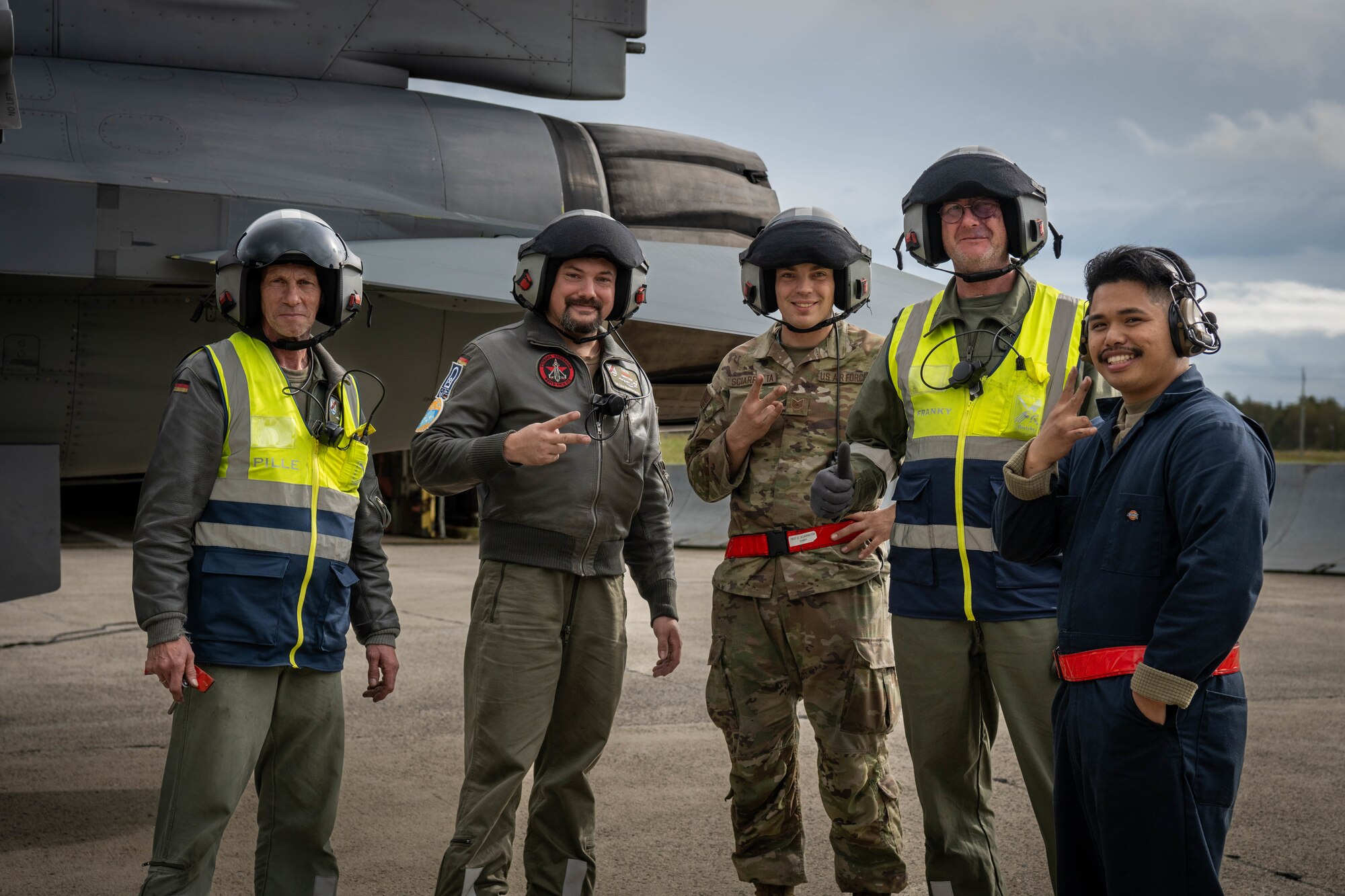 U.S. Air Force Airmen and German Luftwaffe members pose for a photo.