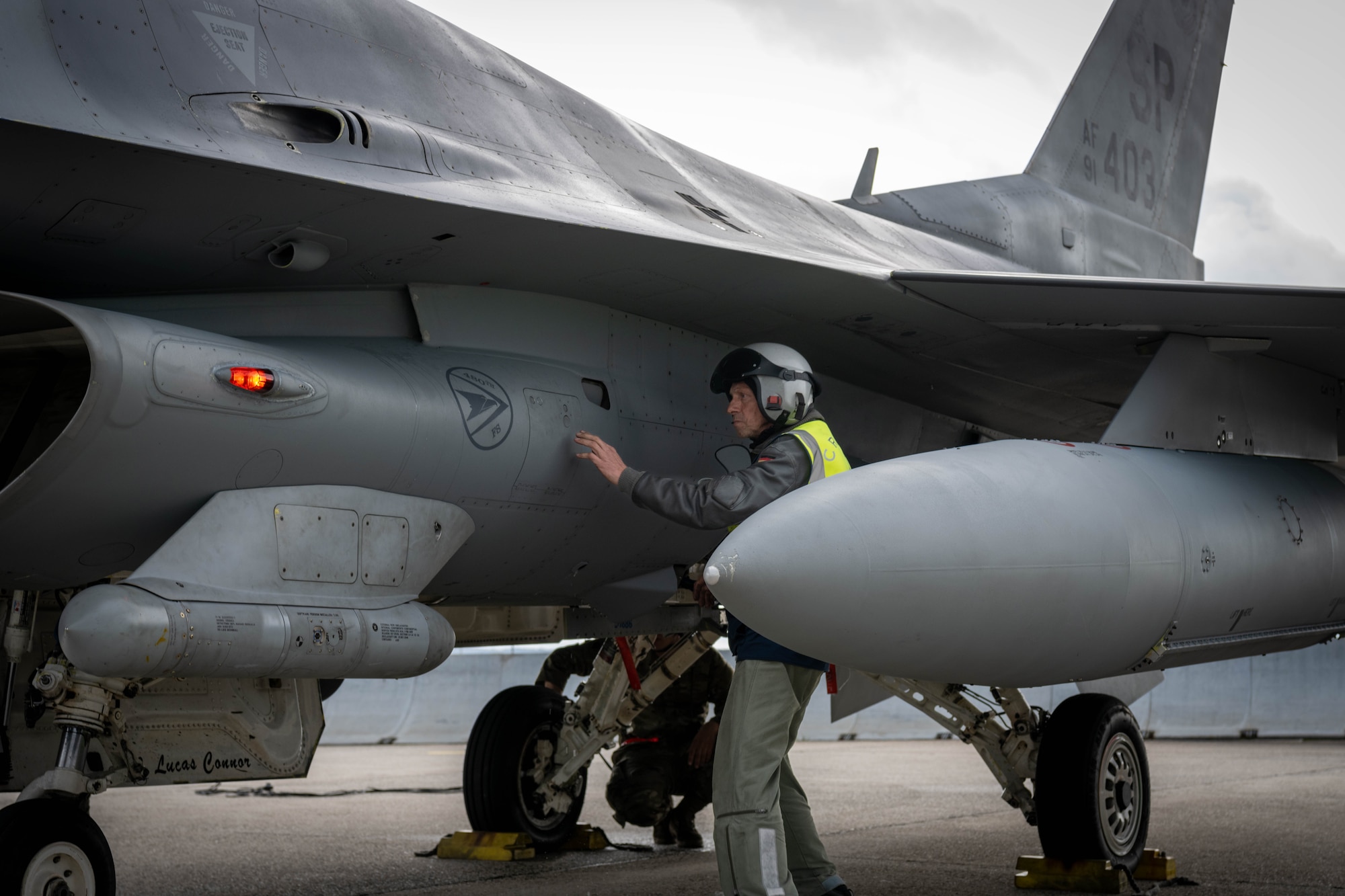 German Luftwaffe maintainer inspects an F-16
