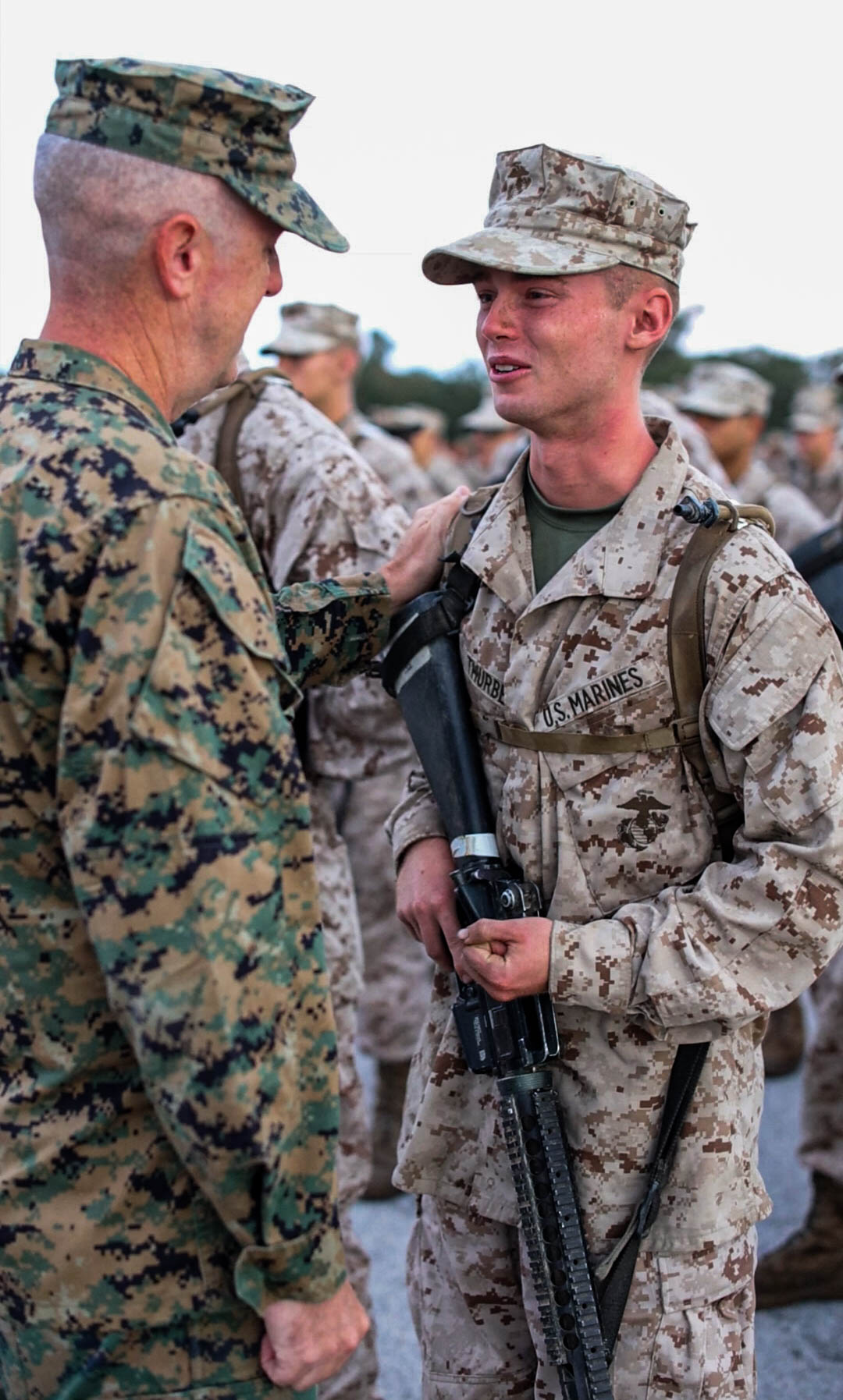 U.S. Marine Corps Sgt. Maj. (Ret.) William Thurber presents his son Pvt. Zachery Thurber, a Marine with India Company, 3rd Recruit Training Battalion, his Eagle, Globe, and Anchor on Marine Corps Recruit Depot Parris Island, Oct. 12, 2024. The presentation of the EGA signifies the transformation from a civilian into a U.S. Marine. (U.S. Marine Corps Photo by Lance Cpl. William Horsley)