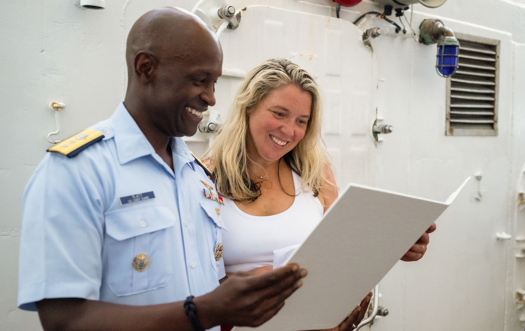 RADM Platt stands with Nicole Kalloch aboard the USCG Eagle.