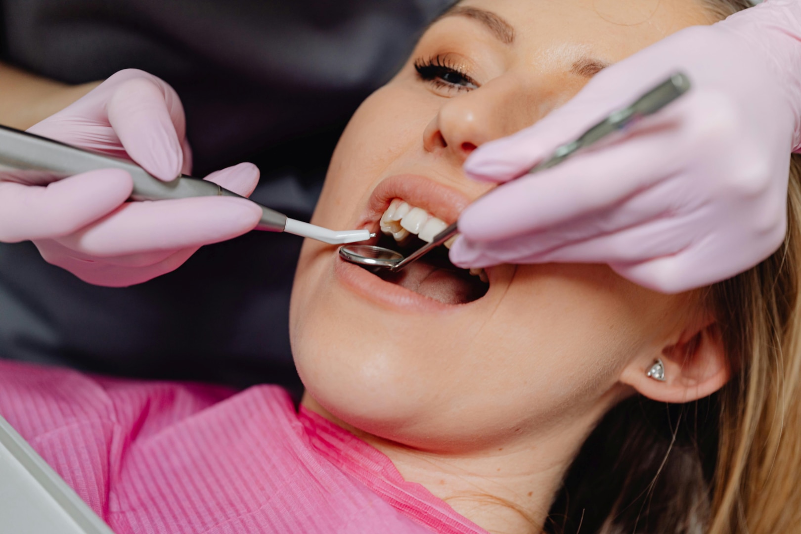 Dentist works on patient's teeth