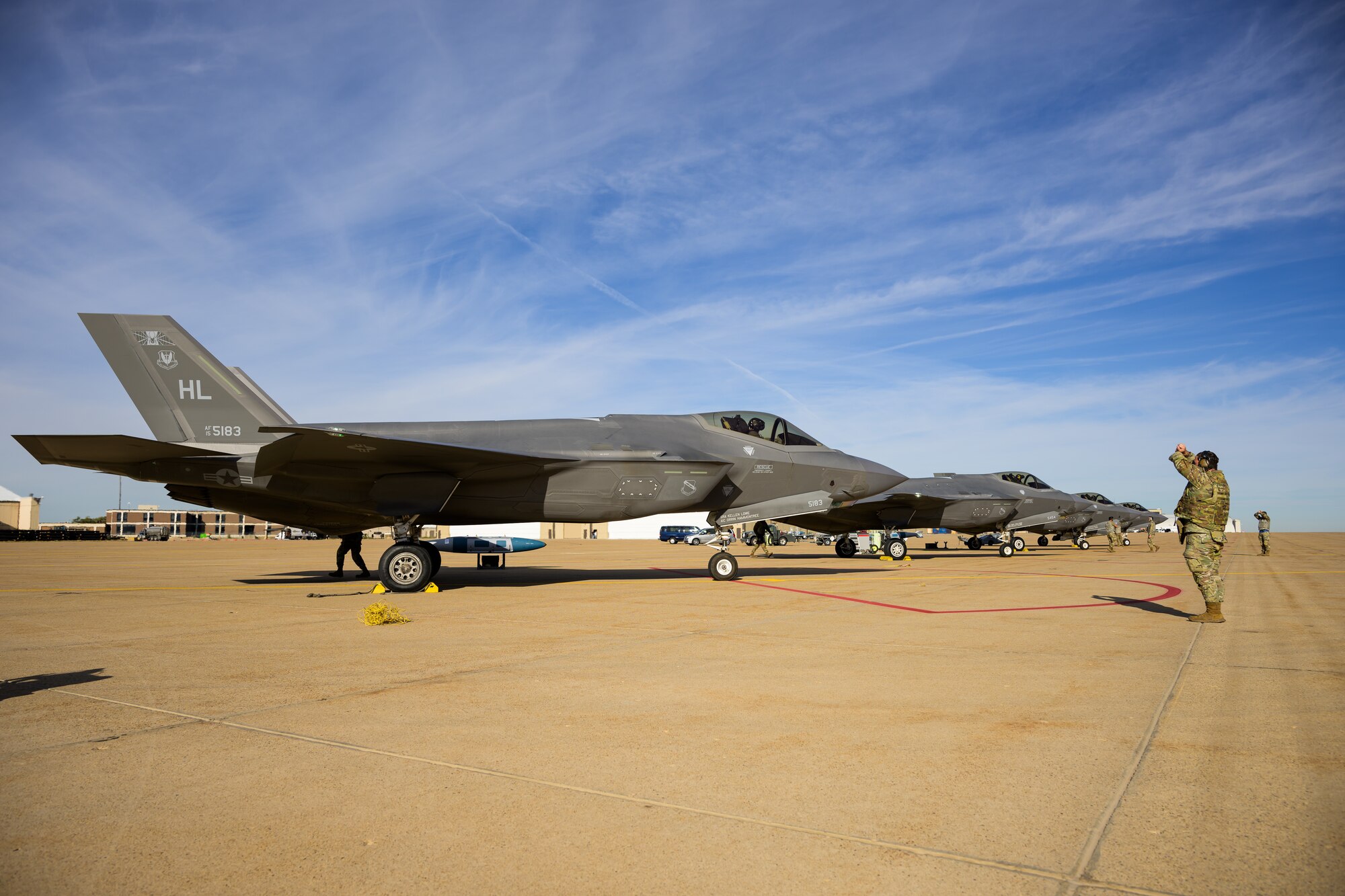 A photo of maintenance Airmen loading and fueling and preparing an F-35A Lightning II for launch.
